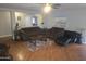 Inviting living room with hardwood floors and a comfortable seating area at 11770 W Aster Dr, El Mirage, AZ 85335