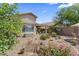 Spacious backyard featuring decorative rocks, landscaping, patio furniture, and covered patio, perfect for outdoor living at 1241 E Elm Rd, San Tan Valley, AZ 85140