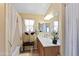 Bright bathroom features neutral color scheme, vanity with double mirrors and wooden cabinets at 1241 E Elm Rd, San Tan Valley, AZ 85140