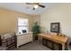 Bedroom featuring a desk and dresser with a large window to allow for natural light at 1241 E Elm Rd, San Tan Valley, AZ 85140