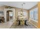 Charming dining room showcasing a chandelier, neutral walls, and a view of the home's interior at 1241 E Elm Rd, San Tan Valley, AZ 85140