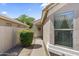 Inviting front entrance with 'Welcome' sign, desert landscaping, and a sidelight at 1241 E Elm Rd, San Tan Valley, AZ 85140