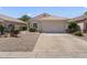 Single-story home with desert landscaping, concrete driveway, and a neutral-colored facade at 1241 E Elm Rd, San Tan Valley, AZ 85140