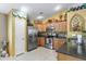 Well-equipped kitchen with stainless steel appliances, ample cabinetry, and a functional layout at 1241 E Elm Rd, San Tan Valley, AZ 85140