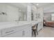 Bright bathroom features double vanity, quartz countertops, and tiled walk-in shower at 1272 W Camina Buena Vis, Queen Creek, AZ 85140
