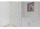 Clean entryway with white door and cabinets featuring modern hardware at 1272 W Camina Buena Vis, Queen Creek, AZ 85140