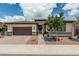 Beautiful single-story home with a well-manicured lawn and a two-car garage at 1272 W Camina Buena Vis, Queen Creek, AZ 85140