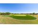 Scenic view of the community golf course with lush green fairways and well-maintained landscaping at 1272 W Camina Buena Vis, Queen Creek, AZ 85140