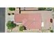 An aerial view of a home with a red tiled roof, showcasing its layout and landscaping at 15802 W Watson Ln, Surprise, AZ 85379