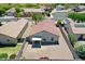 Aerial view of a house highlighting its backyard with covered patio and fenced yard at 15802 W Watson Ln, Surprise, AZ 85379