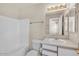 Bathroom features a single sink vanity, a tub/shower combo, and a large mirror with attractive lighting at 15802 W Watson Ln, Surprise, AZ 85379
