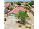 A charming single-Gathering home boasting a well-manicured front yard and attached two-car garage at 15802 W Watson Ln, Surprise, AZ 85379
