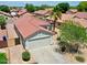 Exterior view of a well-maintained single-Gathering home, featuring a two-car garage at 15802 W Watson Ln, Surprise, AZ 85379