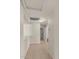 Bright hallway with tiled floor offers access to several rooms and a central light fixture at 15802 W Watson Ln, Surprise, AZ 85379