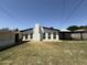 Backyard view features a brick chimney, modest lawn, and potential for outdoor enjoyment at 1723 W Cheryl Dr, Phoenix, AZ 85021