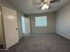 Bedroom with carpeted flooring, ceiling fan, and a window at 1723 W Cheryl Dr, Phoenix, AZ 85021