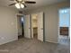 Bedroom with carpeted flooring, ceiling fan, and multiple closets at 1723 W Cheryl Dr, Phoenix, AZ 85021