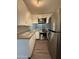 Modern kitchen appliances including a stainless steel refrigerator, microwave, and range enhance this space at 1723 W Cheryl Dr, Phoenix, AZ 85021