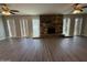 Spacious living room showcasing vinyl flooring, and a stone fireplace at 1723 W Cheryl Dr, Phoenix, AZ 85021