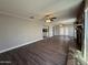 Open living room featuring laminate flooring, ceiling fans and a stone fireplace at 1723 W Cheryl Dr, Phoenix, AZ 85021