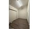 A room with wood-look flooring, a drop ceiling, and plain walls at 1723 W Cheryl Dr, Phoenix, AZ 85021