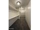 Spacious walk-in closet with wall-to-wall shelving and carpeted floor at 1723 W Cheryl Dr, Phoenix, AZ 85021