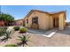 Inviting single-story home featuring desert landscaping, a 2-car garage, and covered entry at 18658 N Tanners Way, Maricopa, AZ 85138