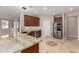 Kitchen boasts granite countertops, stainless steel appliances, and ample cabinet space at 18658 N Tanners Way, Maricopa, AZ 85138