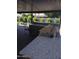 Outdoor kitchen featuring stone counters, a built-in grill, and a cozy dining area at 1954 E Nielson Ave, Mesa, AZ 85204