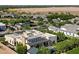 Elevated view of a home with landscaped grounds featuring mature trees and neighborhood surroundings at 19917 E Natalie Way, Queen Creek, AZ 85142