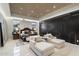 Stunning bedroom with paneled ceilings, modern lighting, lounge seating, and stylish decor at 19917 E Natalie Way, Queen Creek, AZ 85142