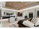 Bright bedroom featuring modern lighting, stylish decor, tiled flooring, and relaxing lounge area at 19917 E Natalie Way, Queen Creek, AZ 85142