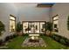 Serene courtyard features a water feature, manicured landscaping, and direct access to the kitchen and living area at 19917 E Natalie Way, Queen Creek, AZ 85142