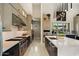 Gourmet kitchen with stainless steel appliances, a long island, and sleek modern cabinetry at 19917 E Natalie Way, Queen Creek, AZ 85142