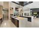Gourmet kitchen featuring a long island, pendant lighting and stainless steel appliances at 19917 E Natalie Way, Queen Creek, AZ 85142