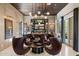 The living room has a stylish bar, modern lighting, and comfortable seating, creating a luxurious gathering space at 19917 E Natalie Way, Queen Creek, AZ 85142