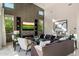 A cozy living room with tile accents, a fireplace, and a television for entertainment and relaxation at 19917 E Natalie Way, Queen Creek, AZ 85142