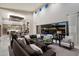 Open living area with modern lighting, high ceilings, seamless indoor-outdoor flow to the pool and patio at 19917 E Natalie Way, Queen Creek, AZ 85142