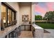 Beautiful outdoor kitchen featuring a gray marble bar, perfect for entertaining guests and enjoying the backyard view at 19917 E Natalie Way, Queen Creek, AZ 85142