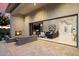 Indoor-outdoor living, seamlessly blending a cozy patio with a fireplace to a spacious living room for ultimate entertainment at 19917 E Natalie Way, Queen Creek, AZ 85142