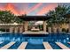 Stunning swimming pool with a covered platform lounge area, perfect for relaxing and enjoying the outdoors at 19917 E Natalie Way, Queen Creek, AZ 85142