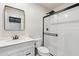 Updated bathroom featuring sleek vanity, black hardware, and glass enclosed shower at 20 W Pasadena Ave, Phoenix, AZ 85013