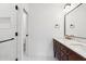 Bathroom featuring a marble countertop, dark wood vanity, and subway tile shower at 20 W Pasadena Ave, Phoenix, AZ 85013