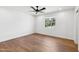 Spacious bedroom with a ceiling fan and natural light streaming in through the window at 20 W Pasadena Ave, Phoenix, AZ 85013