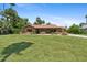 Charming single-story brick home featuring tile roof and mature landscaping at 20 W Pasadena Ave, Phoenix, AZ 85013
