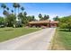 Charming single-story brick home featuring tile roof and mature landscaping at 20 W Pasadena Ave, Phoenix, AZ 85013
