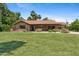 Charming single-story home with a red tile roof and a lush green lawn in a sunny setting at 20 W Pasadena Ave, Phoenix, AZ 85013