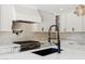 Close-up of a stylish kitchen showcasing modern fixtures and premium appliances at 20 W Pasadena Ave, Phoenix, AZ 85013