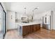 Spacious kitchen with central island, stainless steel appliances, and ample cabinet space at 20 W Pasadena Ave, Phoenix, AZ 85013