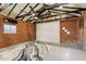 Living room with exposed brick walls, modern rug, ceiling fan, and bright lighting at 20 W Pasadena Ave, Phoenix, AZ 85013